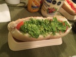 Completo: A hot dog topped with avocado, tomatoes, and mayo