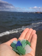 Although the beach was covered in trash and rocks, there was so much sea glass!